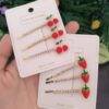 25E-57 - PRENDEDOR PARA CABELLO CHERRY/STRAWBERRY POR DOCENA (12 PIEZAS)