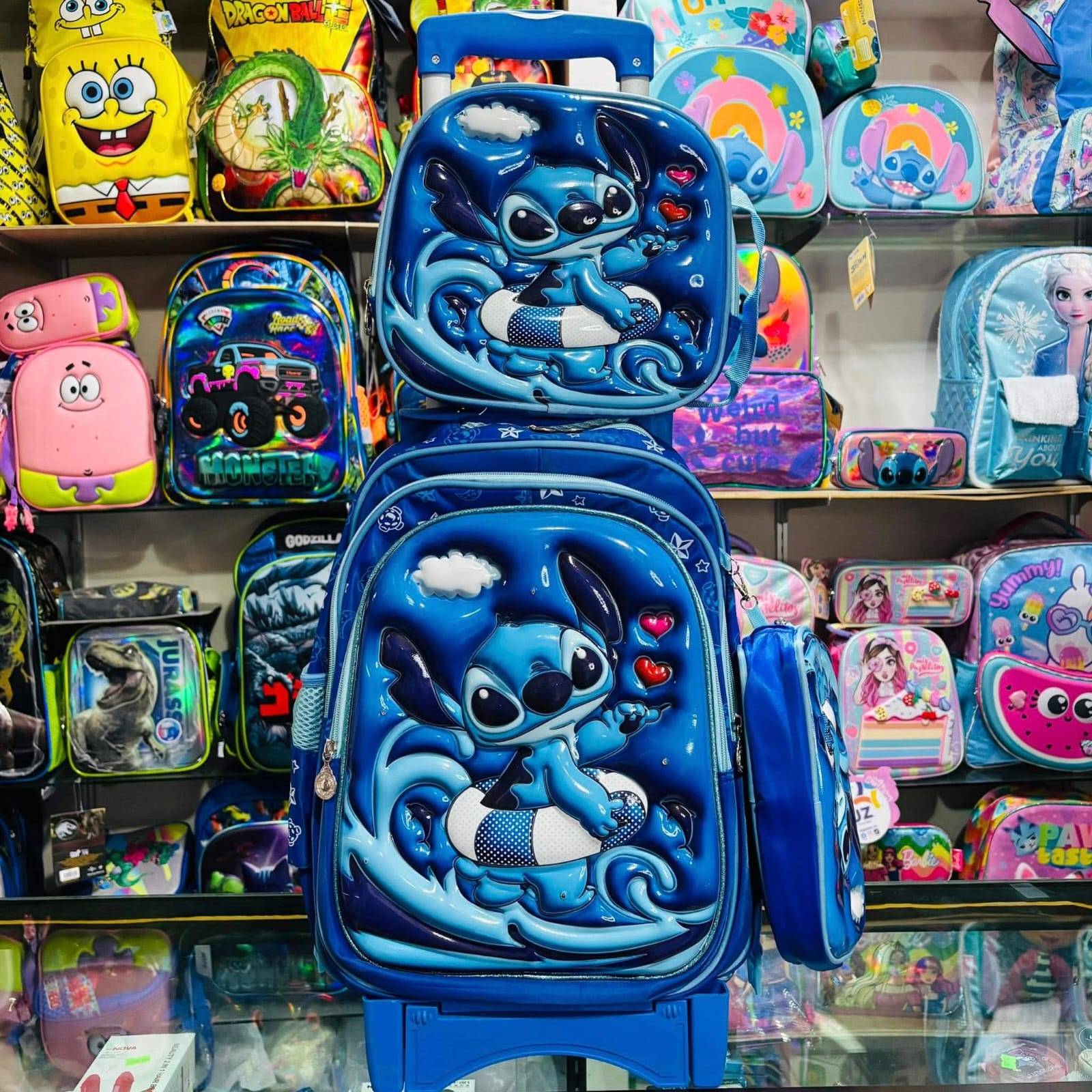 LU9387B - TRIO ESCOLAR DE MOCHILA DE PRIMARIA CON CARRITO X PERSONAJES (1 PZA)