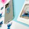 25L101- DOCENA POPSOCKET PARA CELULAR "STITCH". (1 DOCENA)