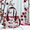 CCL243 - CROSSBODY "COACH" CON LLAVERO DE CEREZA. (1 PZA)