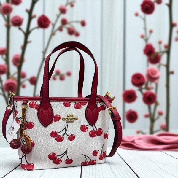 CCL243 - CROSSBODY "COACH" CON LLAVERO DE CEREZA. (1 PZA)