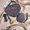 1006- BOLSA DUO "COACH" CORAZÓN CON MUÑEQUERA.  (1 PZA)