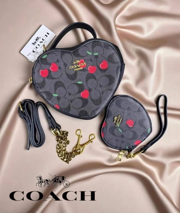 1006- BOLSA DUO "COACH" CORAZÓN CON MUÑEQUERA.  (1 PZA)