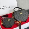 1006- BOLSA DUO "COACH" CORAZÓN CON MUÑEQUERA.  (1 PZA)
