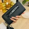 LL2829- CARTERA / MUÑEQUERA "STEVE MADDEN" DOBLE CIERRE. (1 PZA)