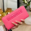 LL2829- CARTERA / MUÑEQUERA "STEVE MADDEN" DOBLE CIERRE. (1 PZA)