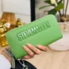LL2829- CARTERA / MUÑEQUERA "STEVE MADDEN" DOBLE CIERRE. (1 PZA)