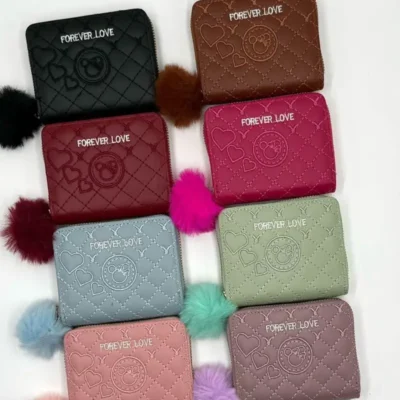 586- DECENA DE MONEDERO CON POMPON. (1 PZA)