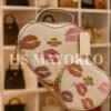 1006- BOLSA DUO "COACH" CORAZÓN CON MUÑEQUERA.  (1 PZA)