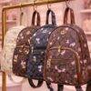 L-K279799 - MOCHILA DISEÑO PERSONAJES y CHERRY x "COACH" (1 PZA)