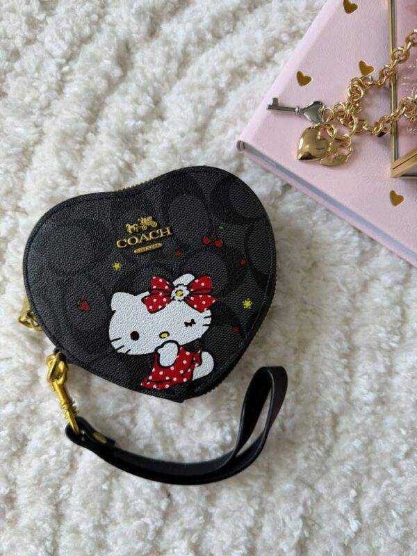 WXL-1149 - MONEDERO EN FORMA DE CORAZON DE PERSONAJES x "COACH" CON CAJA (1 PZA)