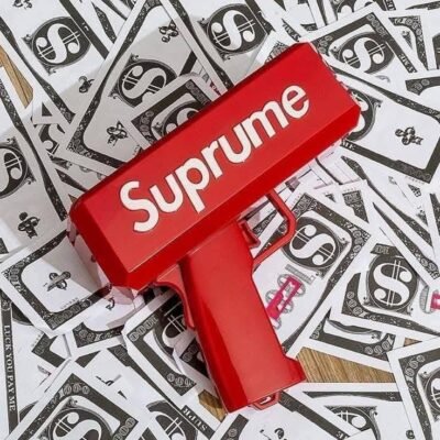 SUP99 - PISTOLA LANZABILLETES x "SUPREME" (1 PZA)