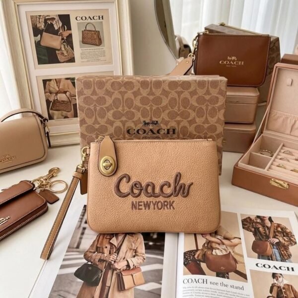 KFC-8301 - MUÑEQUERA CON SEGURO x "COACH" (1 PZA)