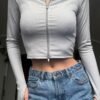 DY54282 - CHAMARRA DEPORTIVA CORTE "CROP" PARA DAMA POR TERCIA (3 PIEZAS)