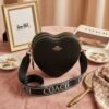 WY-0363Q - CROSSBODY EN FORMA DE CORAZON CON 3 CIERRES x "COACH" (1 PZA)