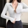 DY54282 - CHAMARRA DEPORTIVA CORTE "CROP" PARA DAMA POR TERCIA (3 PIEZAS)