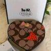 WXL-1063 - MONEDERO EN FORMA DE CORAZON x "COACH" CON CAJA (1 PZA)