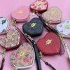 WXL-1063 - MONEDERO EN FORMA DE CORAZON x "COACH" CON CAJA (1 PZA)