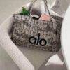 WhatsApp Image 2026-07-18 at 10.13.55 AM (1) YT-666 - TOTE BAG "TIE DYE" x "ALO" (1 PZA)