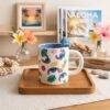 TCB183 - TAZA CON FIGURITA x "STITCH" CON CAJA (1 PZA)