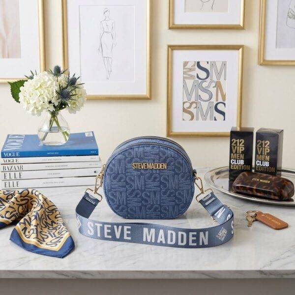 WXL-712 - CROSSBODY REDONDO CON DOBLE CIERRE x "STEVE MADDEN" (1 PZA)