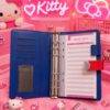 8590 - LIBRETA "ORGANIGASTO" DE "SNOOPY y HELLO KITTY" x "COACH" (1 PZA)
