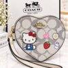WXL-1149 - MONEDERO EN FORMA DE CORAZON DE PERSONAJES x "COACH" CON CAJA (1 PZA)