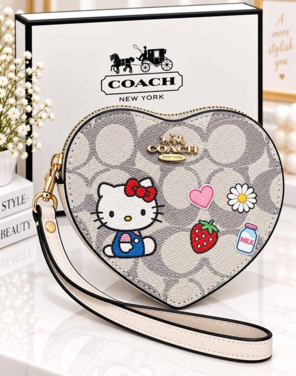 WXL-1149 - MONEDERO EN FORMA DE CORAZON DE PERSONAJES x "COACH" CON CAJA (1 PZA)