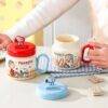 TCB189 - TAZA DE CERAMICA CON TAPA x "SNOOPY" (1 PZA)